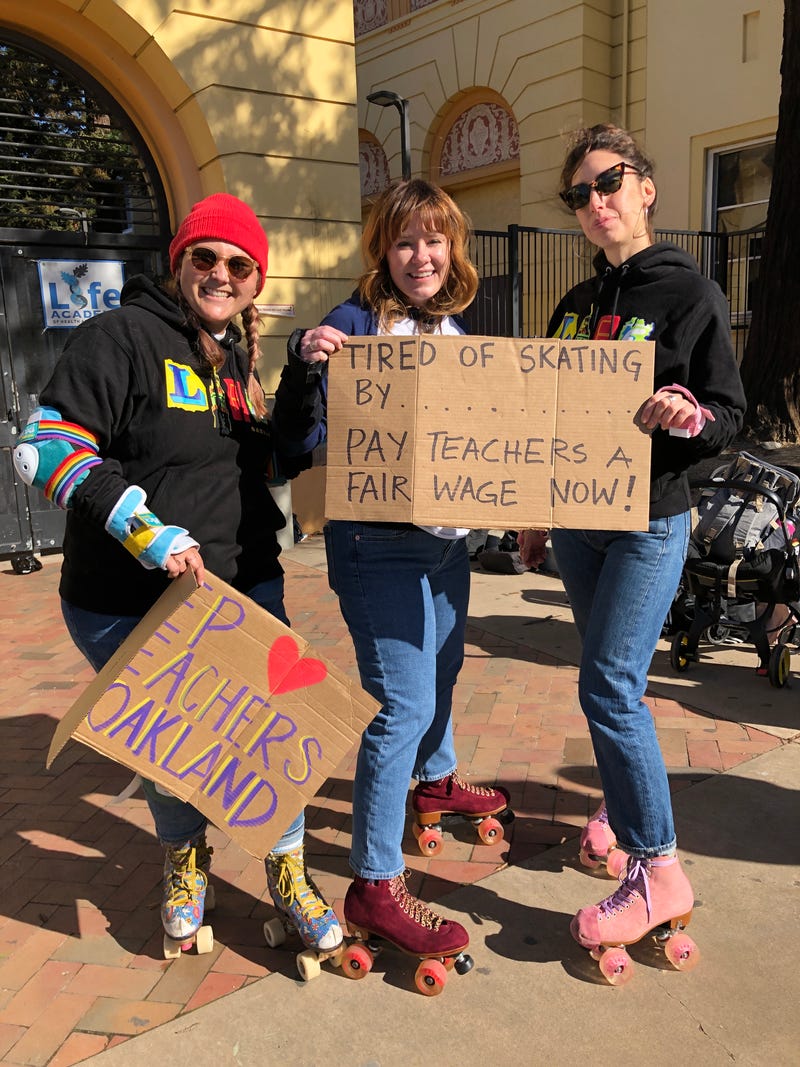 At the Life Academy and United For Success campus on 35th Ave. near Salisbury St., teachers on roller skates held up signs.