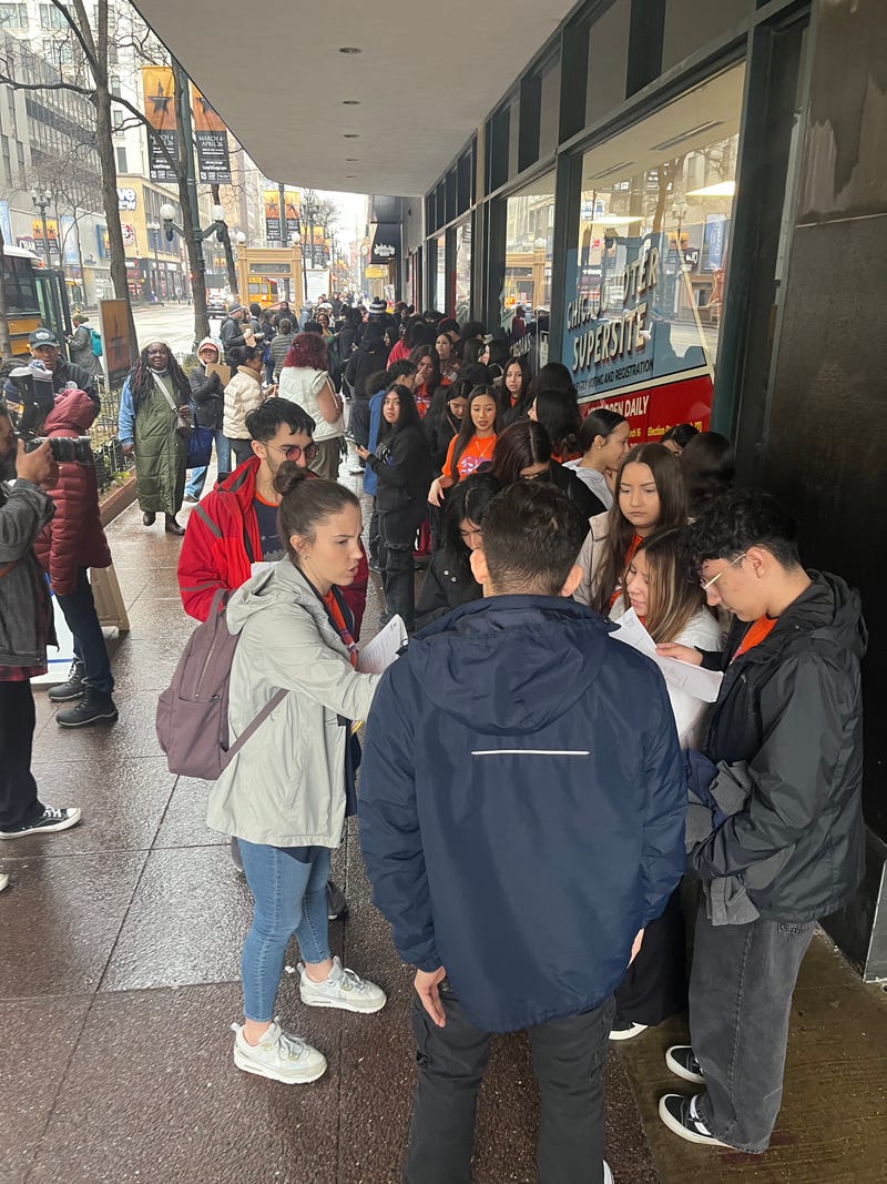 Students from Pritzker College Prep High School line up outside the Chicago Voter Supersite in the Loop.