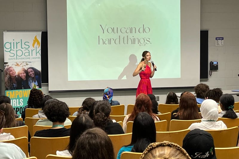 A speaker addresses girls at the 2023 Girls Spark Summit at Penn State's Brandywine campus.