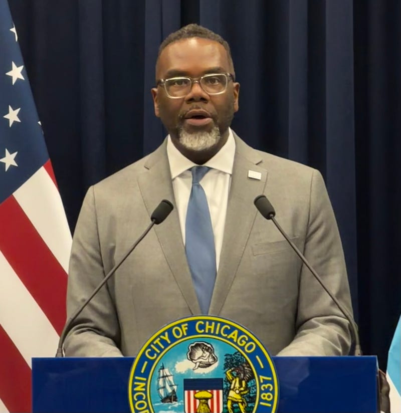 Chicago mayor Brandon Johnson talks to reporters after a City Council meeting March 18. 