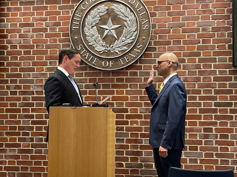 Dallas County Judge Clay Lewis Jenkins swears in Paul Adams as Dallas County Elections Administrator