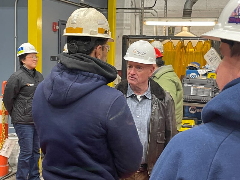 U.S. Sen. Mark Kelly of Arizona (center) visits a training facility at the Philly Shipyard on Tuesday, Feb. 18.