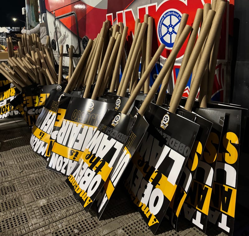 Picket signs outside the Amazon delivery facility in Maspeth on Thursday