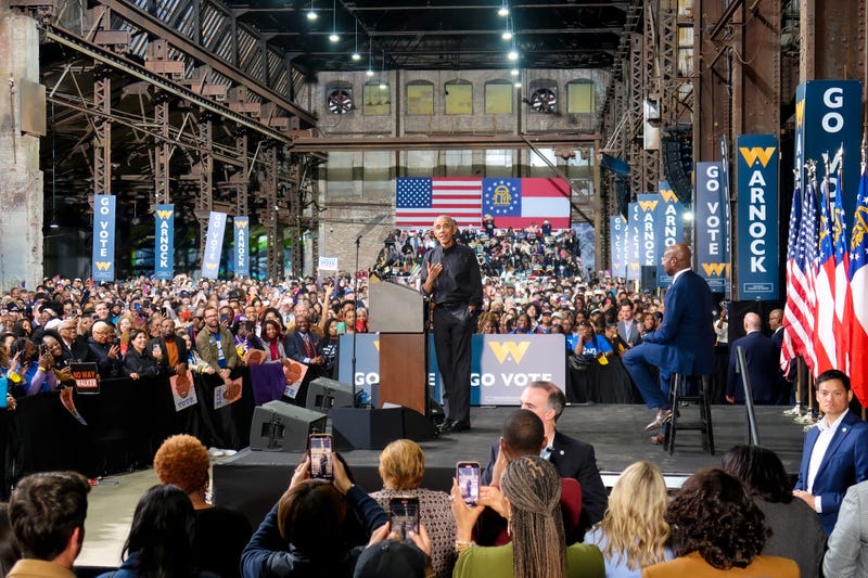 Former President Obama speaking to crowd at a rally