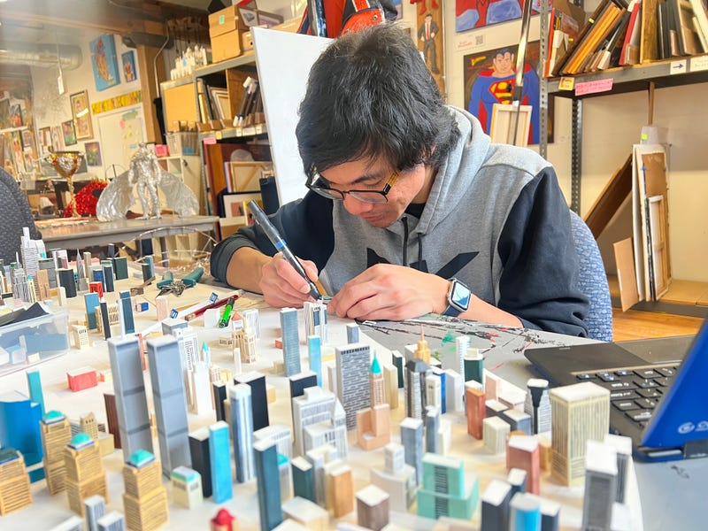 artist woking on sculpture