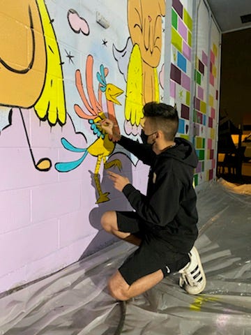 Chicago artists are at the border painting a mural inside one of the shelters housing asylum seeking kids.