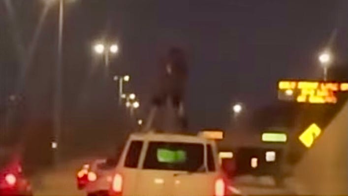 Man chained to roof of SUV rides through Detroit on the Lodge Freeway [WATCH]