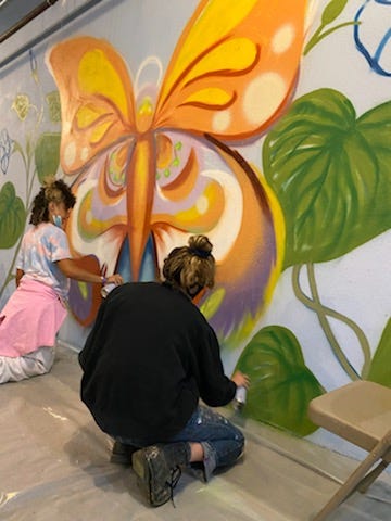 Chicago artists are at the border painting a mural inside one of the shelters housing asylum seeking kids.