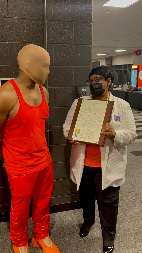 When Kanye West couldn't find his mask to take the Atlanta proclamation presentation photo, he quicly grabbed a stocking cap.