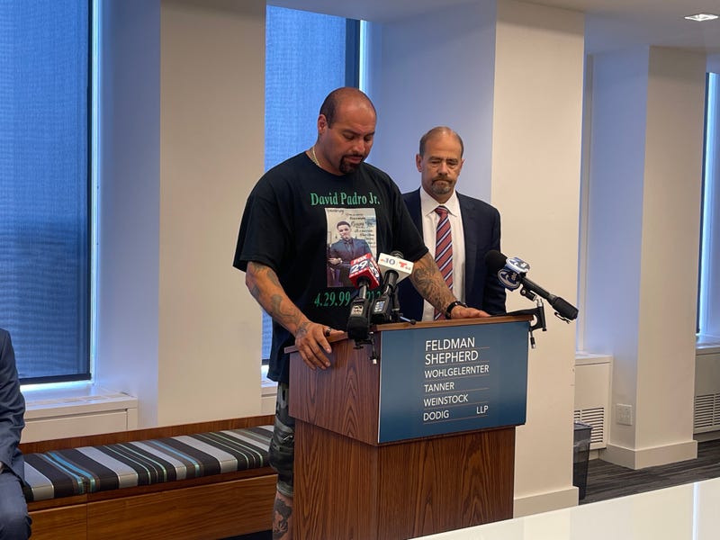 David Padro Gonzalez, father of David Padro Jr., holds back tears as he speaks at a podium next to his attorney, July 27, 2023.