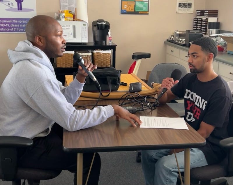 Dwight Taylor Sr. (left) speaking with KCBS Radio's Amani Grant-Pate.