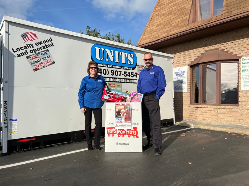 Kris Kay and Greg Caldwell help collect toys for Toys for Tots nonprofit.