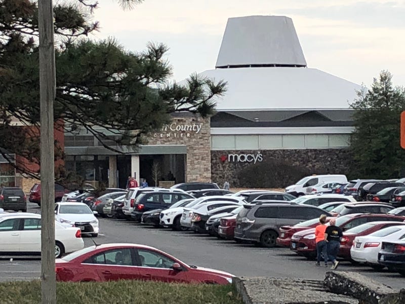 South County Center shopping mall parking lot people walking into entrance of Macys store