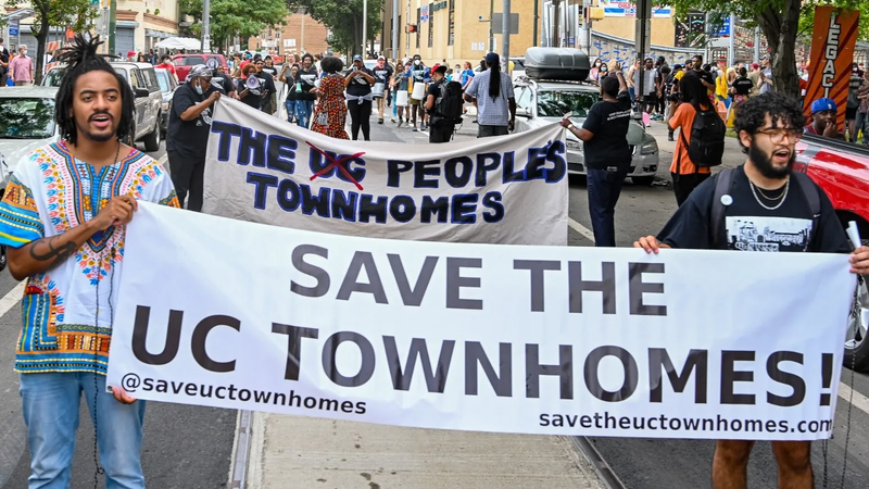 Protesters during a "Save the UC Townhomes" march in July 2022 in University City