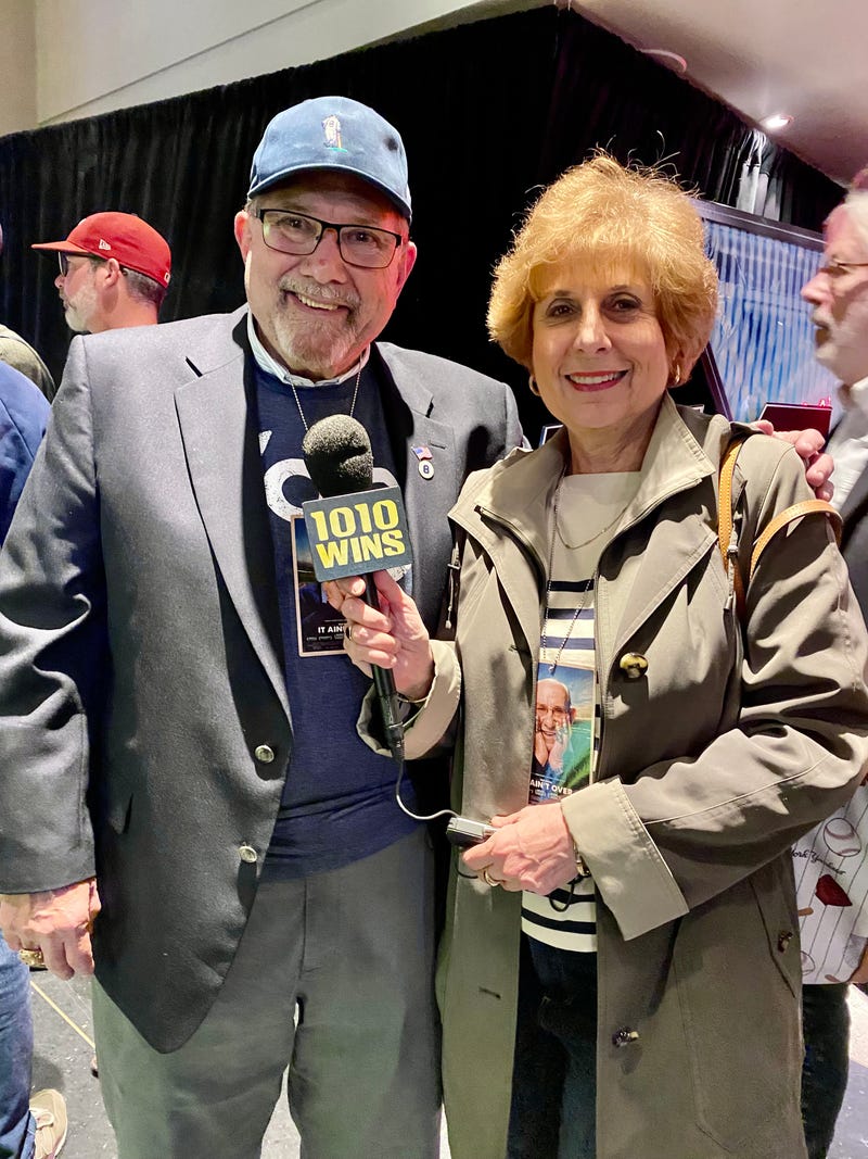 1010 WINS reporter Juliet Papa with Yogi Berra's oldest son, Lawrence Berra.
