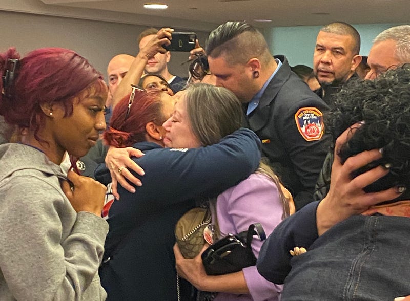 People embrace at the Bronx courthouse during the sentencing Wednesday.