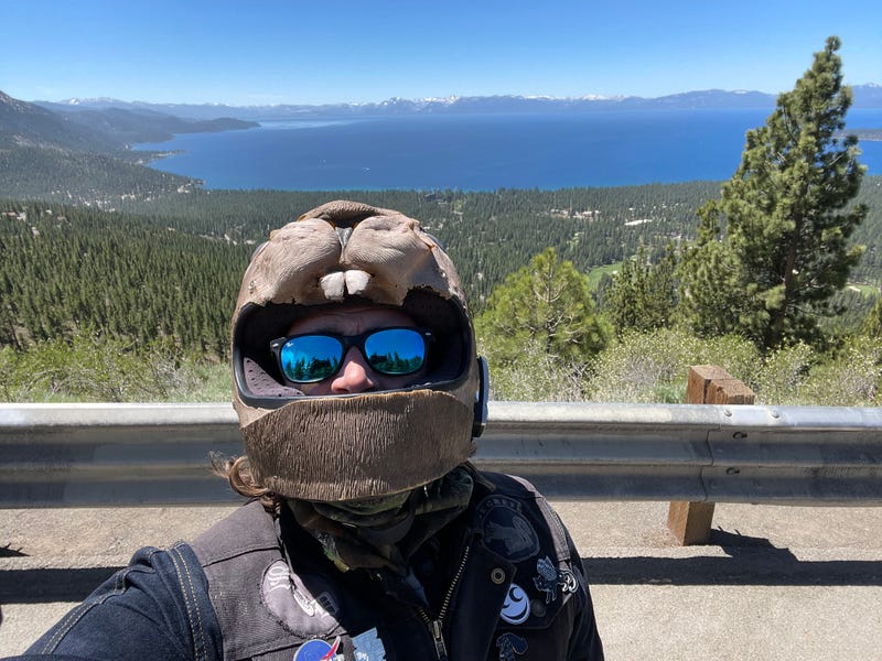 guy in a dumb helmet in front of water