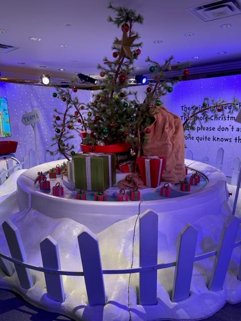 There's a room full of colorful Truffula trees inspired by "The Lorax," a room inspired by the "How The Grinch Stole Christmas," a carousel from "Circus McGurkus" and "The Cat in the Hat" room where patrons can interact with the character himself - a hidden camera and microphone where staff can talk with visitors.
