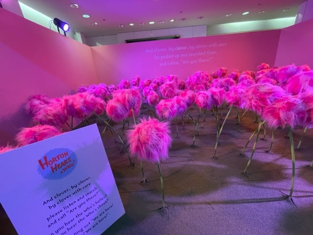 Walk through the 25,000 square foot space off Michigan Avenue, and you might run into the Lorax, frolic through the Truffula trees, explore a field of pink clover, ride a carousel, or even meet the Cat in the Hat himself!