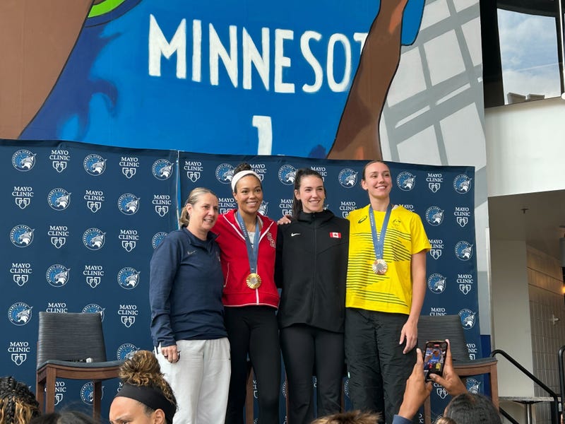 L-R: Head Coach Cheryl Reeve, Team USA's Napheesa Collier, Canada's Bridget Carleton and Alanna Smith of Australia. 