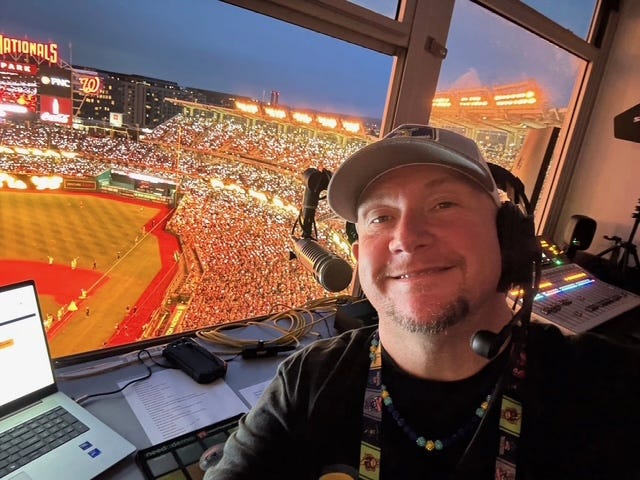 Public Address Announcer Mark Ediss in the press box 