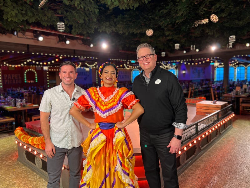 Bennett chats with Juan on Plaza de Coco Restaurant aboard the Disney Treasure