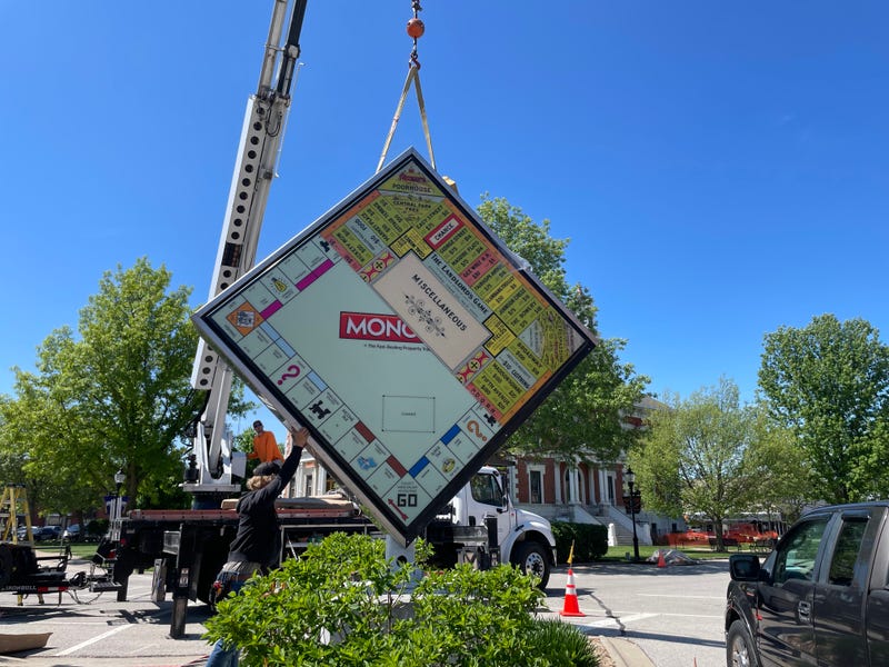 Crews in Macomb, Ill., install a custom game board honoring Lizzie Magie, a local game inventor who created The Landlord's Game -- the precursor to Monopoly.