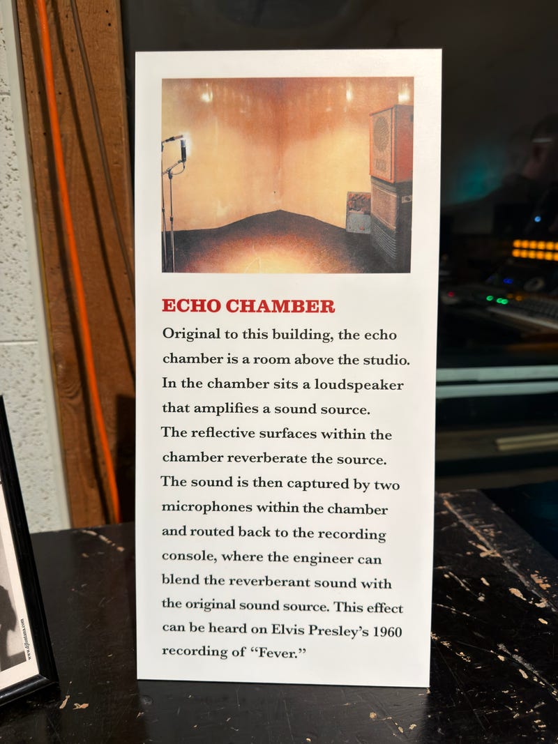 Plaque describing an echo chamber. It includes a photo of a room with a loudspeaker and microphone, explaining sound reflection and Elvis Presley's song "Fever."