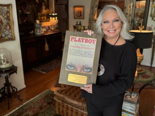 Candace Jordan displays one of her 9 Playboy covers