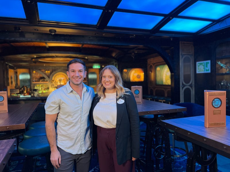 Bennett chats with Alyssa on the Periscope Pub Aboard the Disney Treasure