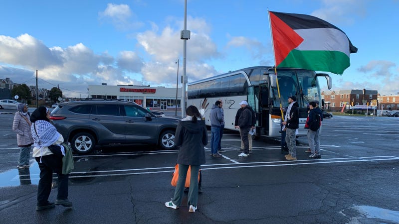A bus carrying pro-Palestinian protesters to Saturday's march on Washington prepares to depart from outside the Macy's on Cottman Avenue in Northeast Philly.