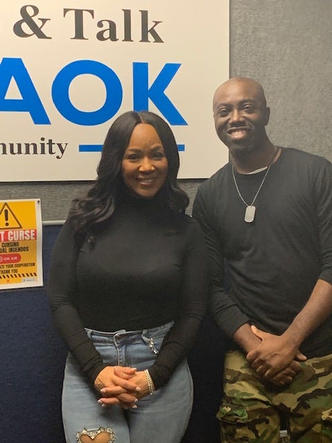 Singer Erica Campbell standing alongside Sean Garvey during an interview on Campbell's new music and mental health.