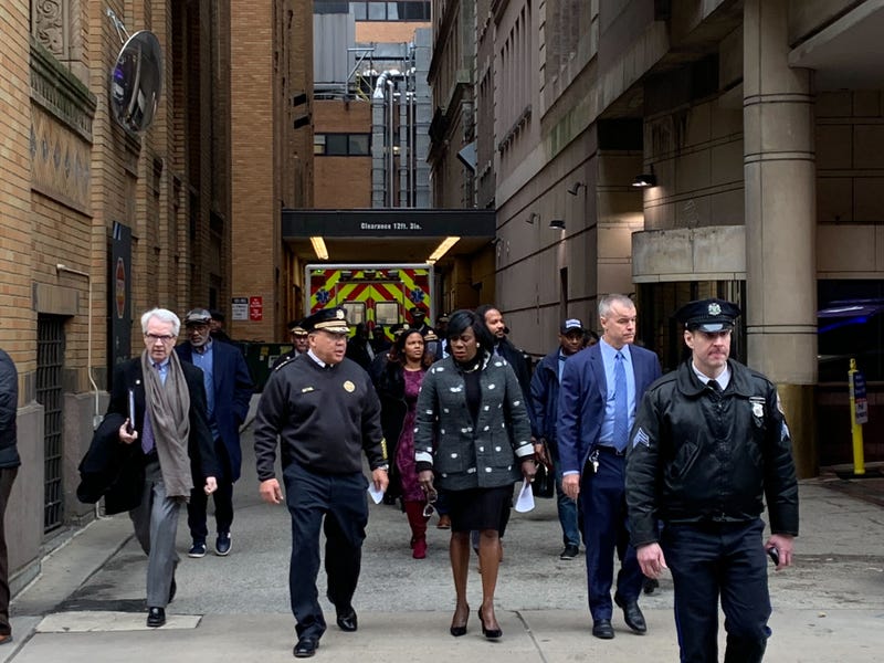 Philadelphia Police Commissioner Kevin Bethel (second from left) and Mayor Cherelle Parker (third from left) walk out of Jefferson Hospital to address the media after a police officer was shot in the hand while serving a warrant, Jan. 31, 2024.