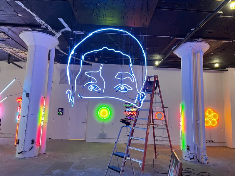 A massive 14-foot-tall neon sculpture by artist John Bannon that changes based on your angle of view.