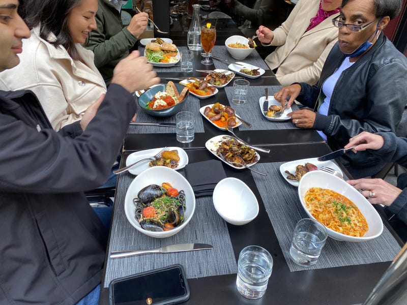 A group eating a Barbacco in San Francisco.