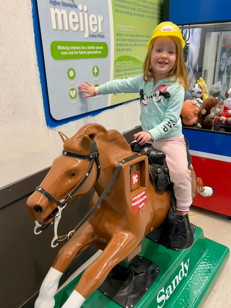 Child riding Sandy the Pony