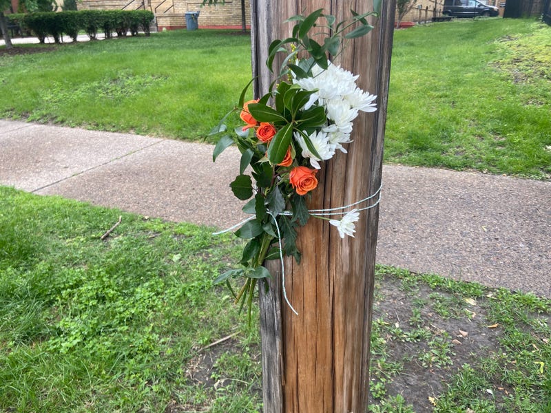 Flowers near 22nd and Blaisdell remember the victims of Thursday night's shooting in South Minneapolis.  