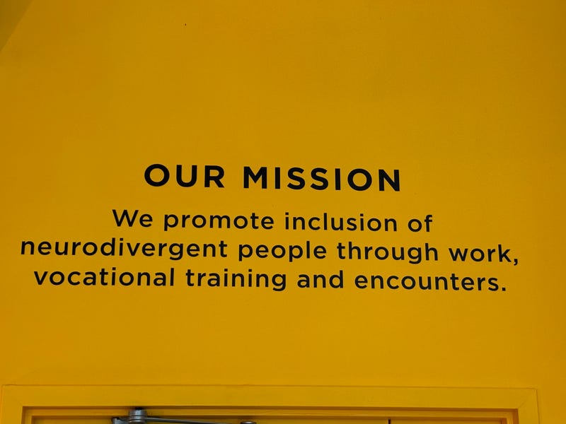 Café Joyeux in Manhattan, on July 20, 2024, displays its mission on the wall of the midtown eatery.