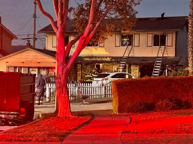 A three-alarm fire engulfed a San Jose home on Tuesday and killed one woman.
