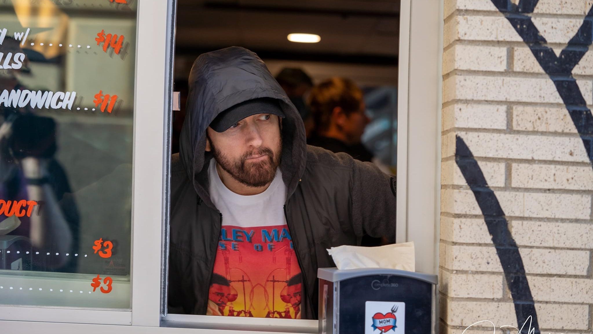 Eminem serves customers as “Mom’s Spaghetti” restaurant opens in downtown Detroit