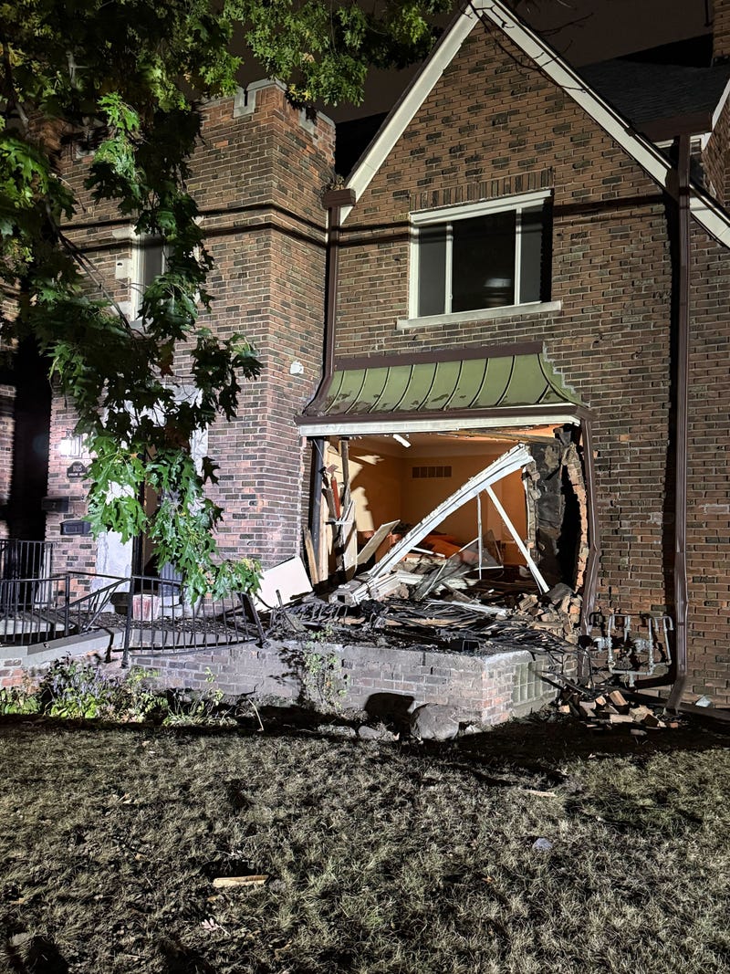 large hole in house after crash