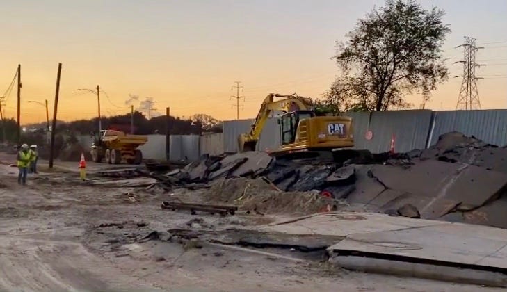 Construction crew works on Dearborn Street in Southwest Detroit