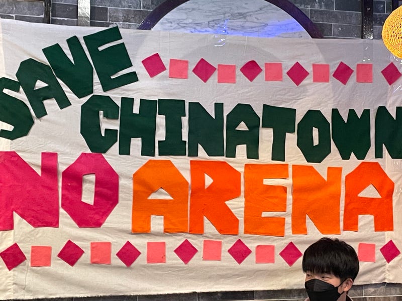 sign reads "save Chinatown, no arena"