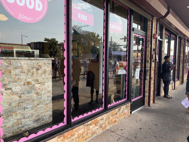 Crystal Bradley outside storefront refurbished from City of Philadelphia-funded initiatives.