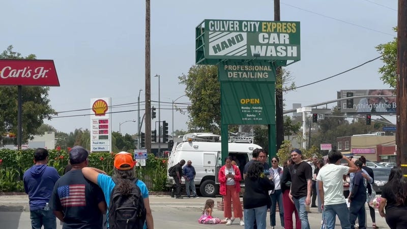 people in car wash parking lot