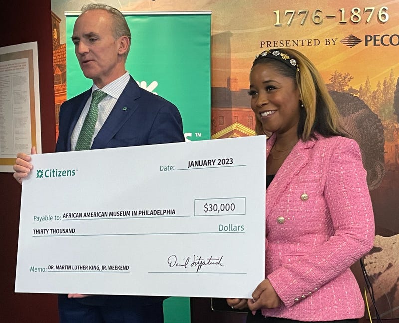 Citizens Mid-Atlantic President Daniel Fitzpatrick (left) presents a $30,000 check to African American Museum in Philadelphia President and CEO Ashley Jordan, to support the museum's MLK weekend programming.