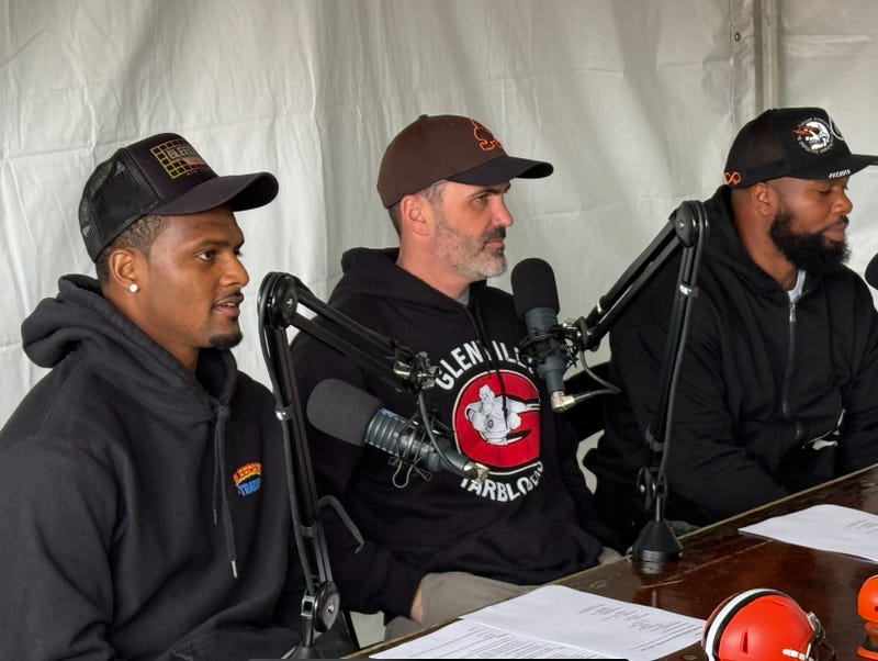 Browns quarterback Deshaun Watson (L) records a podcast with Browns head coach Kevin Stefanski (C) and his quarterbacks coach Quincy Avery (R) at the grand opening of Lefty's Cheesesteaks in University Heights, Ohio.