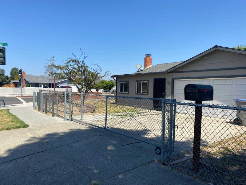 Concrete fence surrounds Ray Minter's home on Jackson Avenue in East San Jose.