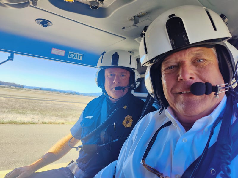 KCBS Radio reporter Jeffrey Schaub with Mark Heine, Fire Chief of the Sonoma County Fire District, in the county's first firefighting helicopter
