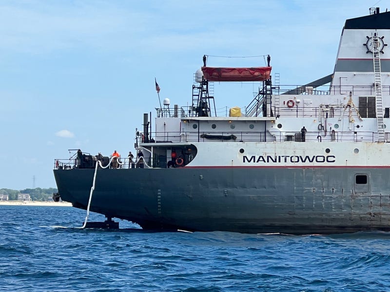 U.S. Coast Guard personnel, along with state and local agencies, are responding to an oil spill in Lake Michigan after a freighter discovered a hole in its hull on Wednesday.